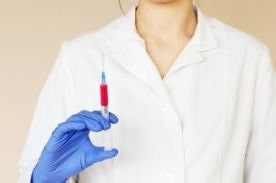 Healthcare worker preparing vaccine.