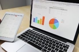 data on laptop and tablet.