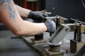 person working on machinery.