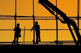 two construction workers on site.