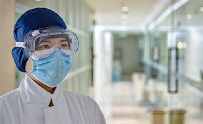 Employee wearing personal protective equipment.