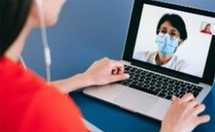 Woman in telehealth appointment.