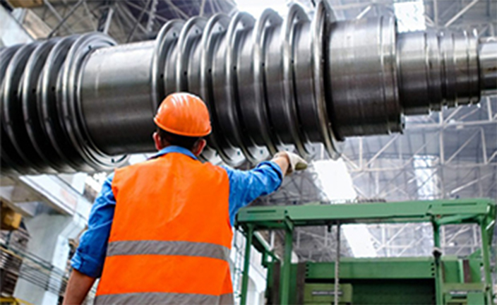 Worker examining equipment.