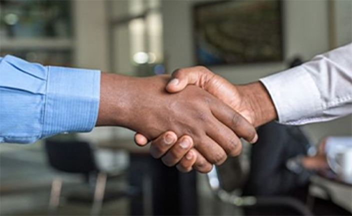 Two men shaking hands.