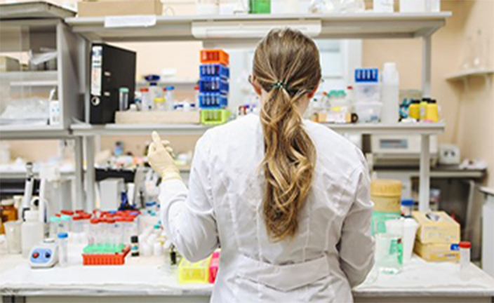 Pharmacy tech preparing medication.