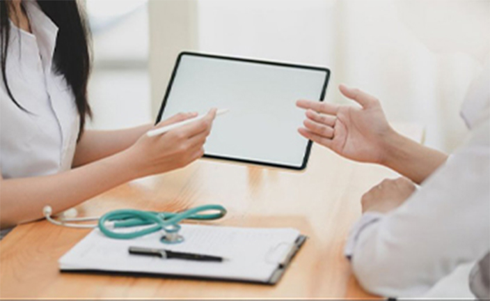 Woman and man discussing healthcare.