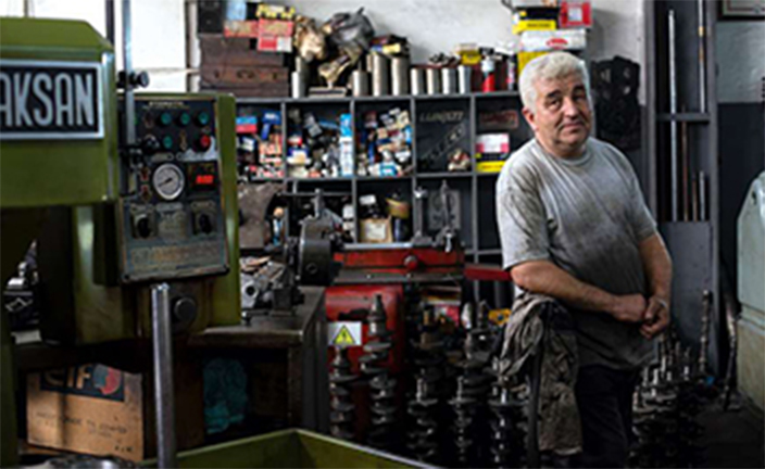 Man in repair shop.