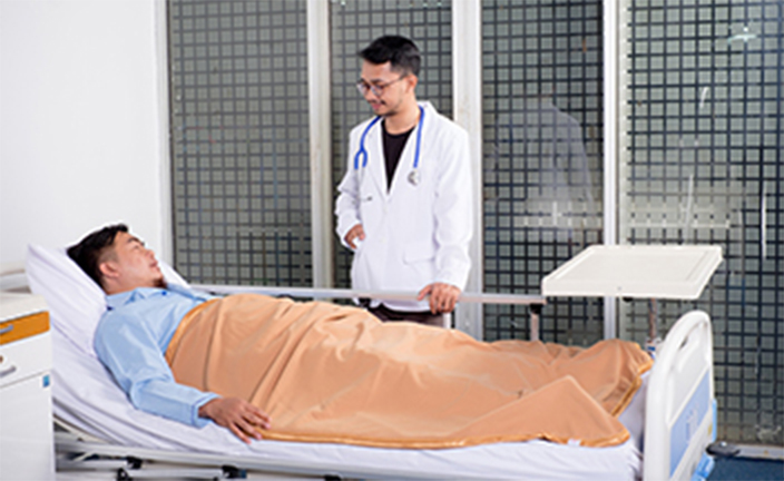Doctor checking on patient in bed.