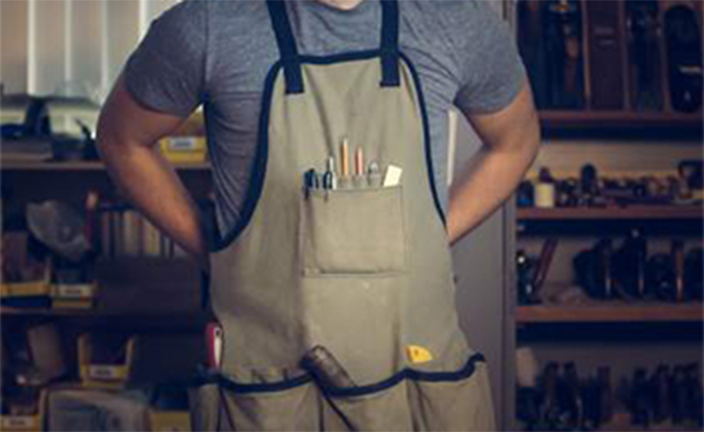 Man wearing work apron.