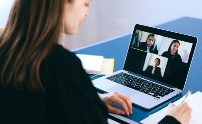 woman using computer for video meeting.