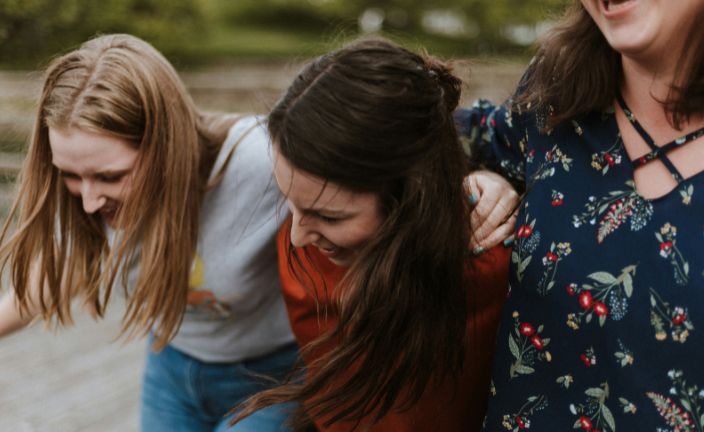 three girls smiling and having fun.