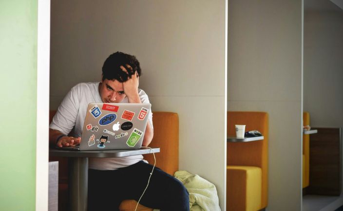 man working on a laptop.