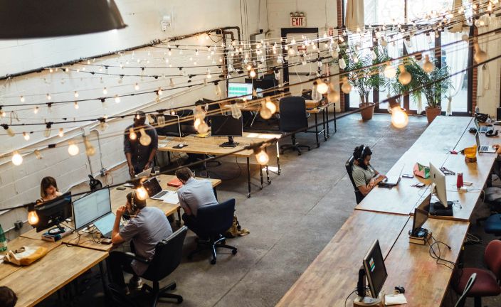 workers in an open-concept office.