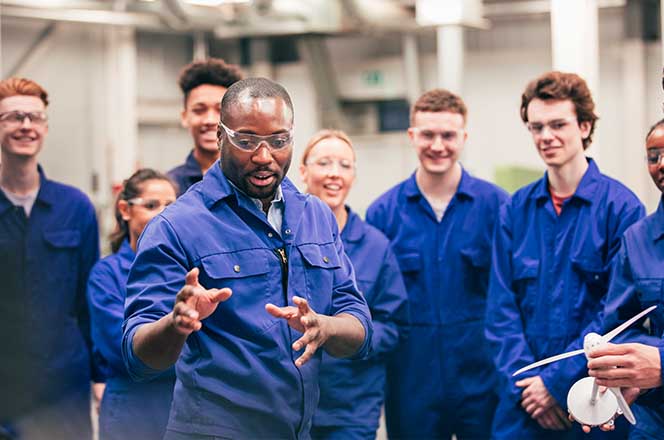 Factory workers receiving instruction. 