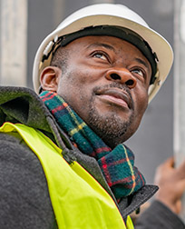 Construction Worker looking up.