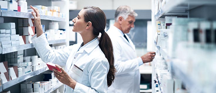 Pharmacists working to fill prescriptions.