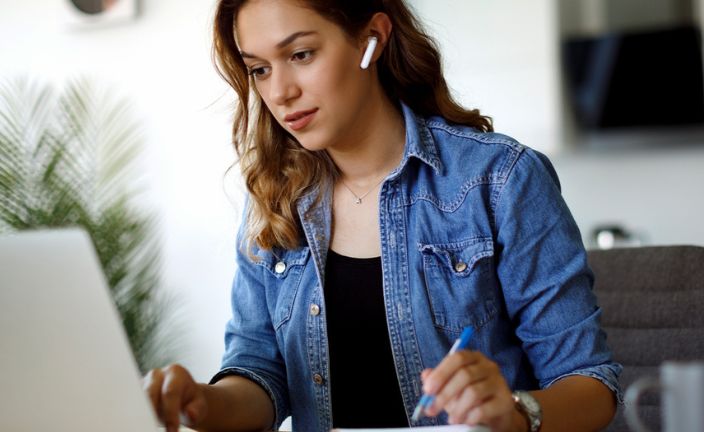 woman studying on laptop.