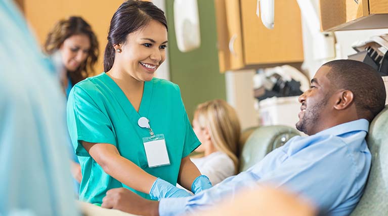 medical professional assisting a patient.
