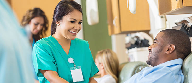 medical professional assisting a patient.