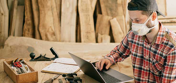 carpenter working on laptop.