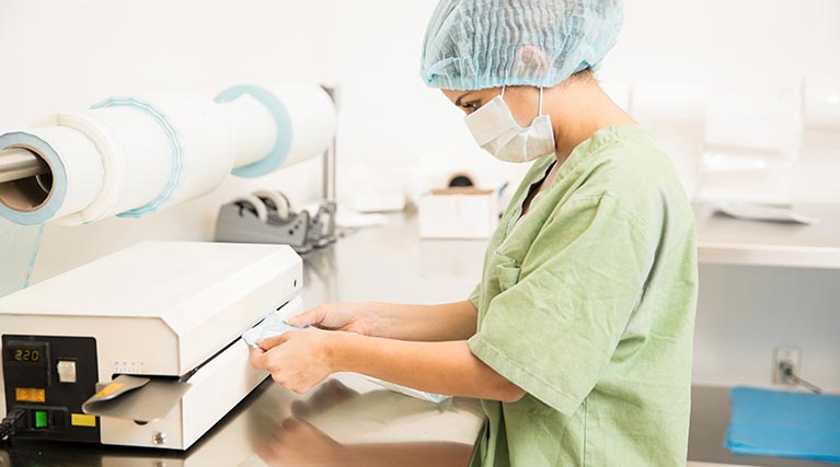 Sterile Processing employee at work in a lab.